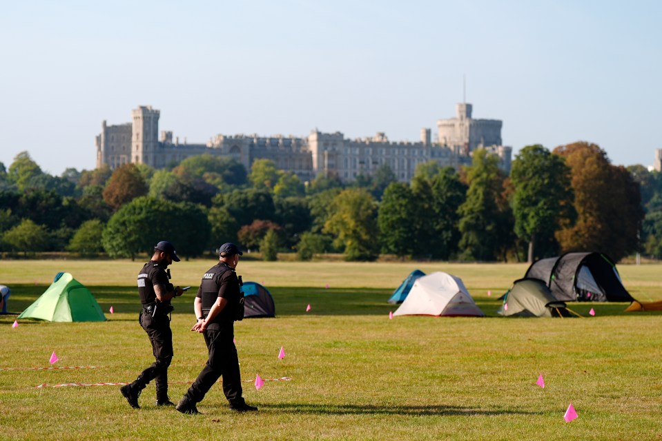 Cops monitor the campsite in the Royal Park