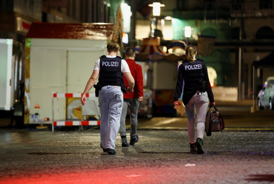 Police officers work at the scene