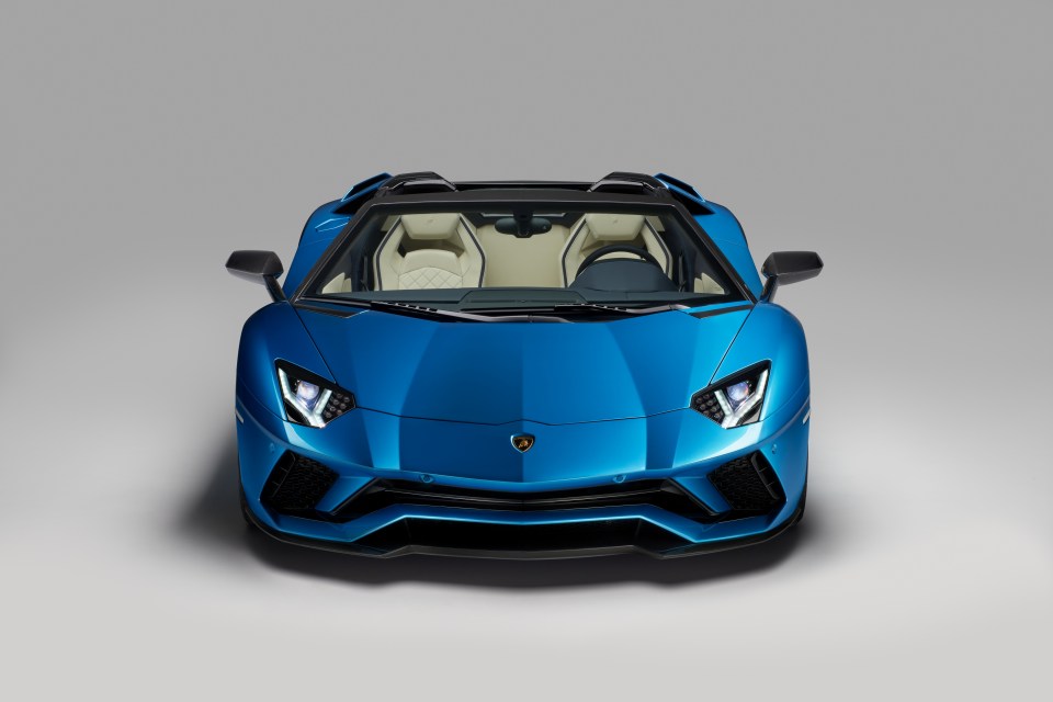 the front of a blue lamborghini aventador roadster