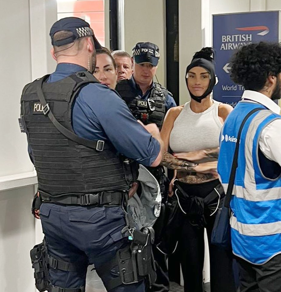 a group of people are standing in front of a sign that says british airways