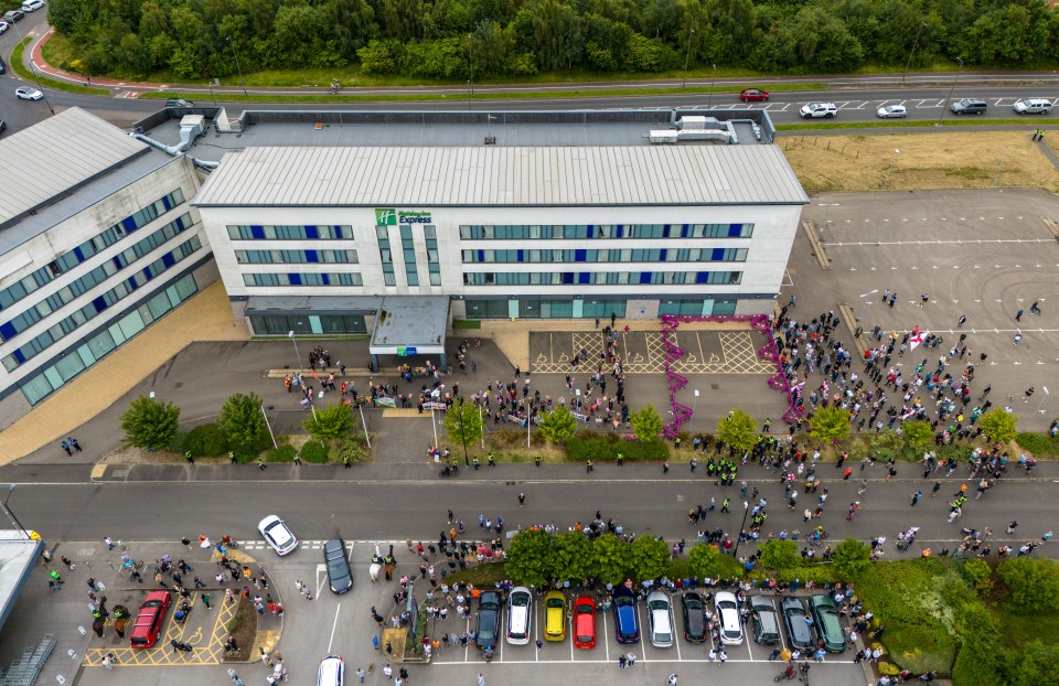 Crowds gathered at a migrant hotel in Rotherham this morning