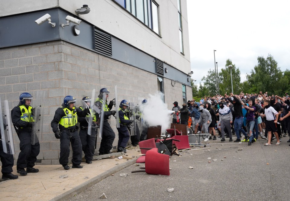 Cops clashed with protesters outside the hotel, which is being used to house asylum seekers