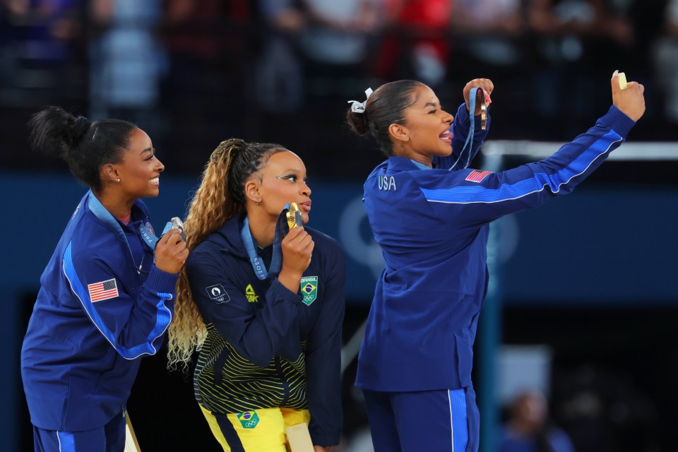 Athletes take a picture with the phone during their medals ceremonies