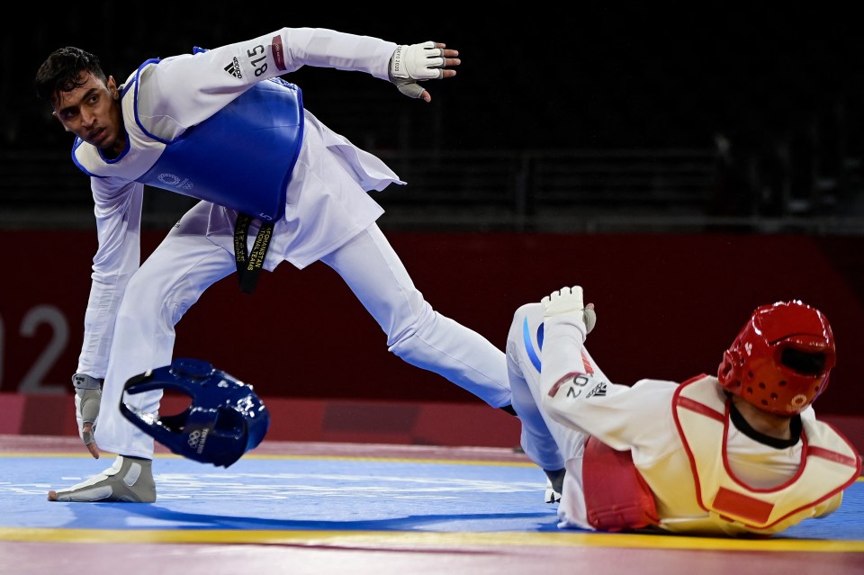 a taekwondo fighter wearing a blue belt with the number 516 on it