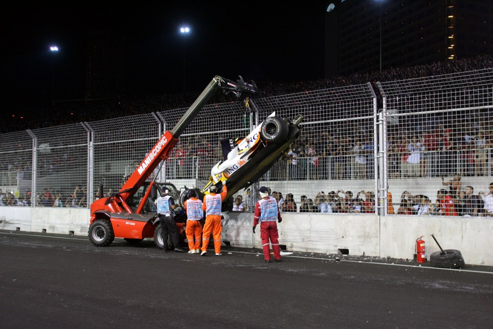 The aftermath of Nelson Piquet's crash into a wall at the Singapore Grand Prix in  September 2008.