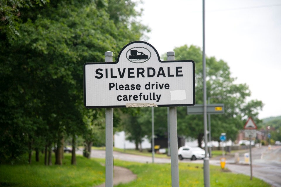 a silverdale sign asks people to drive carefully