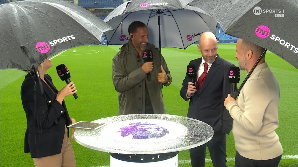 a group of people standing under umbrellas that say tnt sports