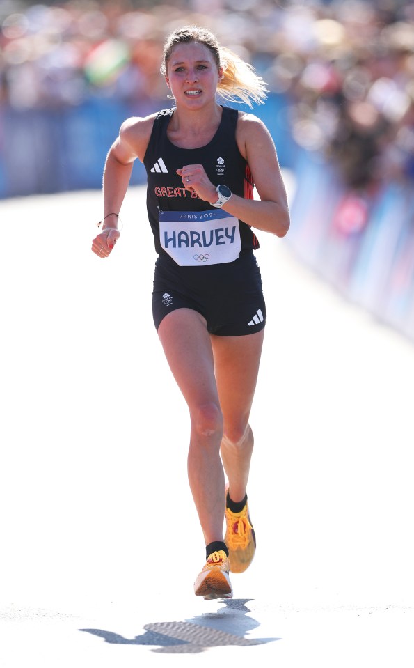 a woman in a yellow top and shorts is running