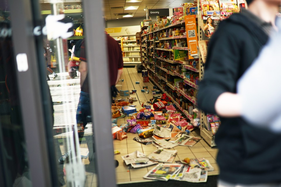 A Sainsbury's shop is seen after being looted in Manchester