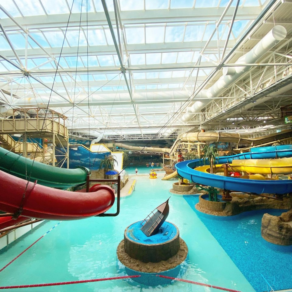 a water park with a pirate ship in the middle