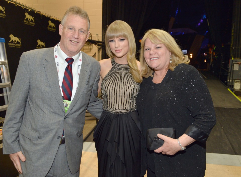 Taylor with her parents Andrea and Scott