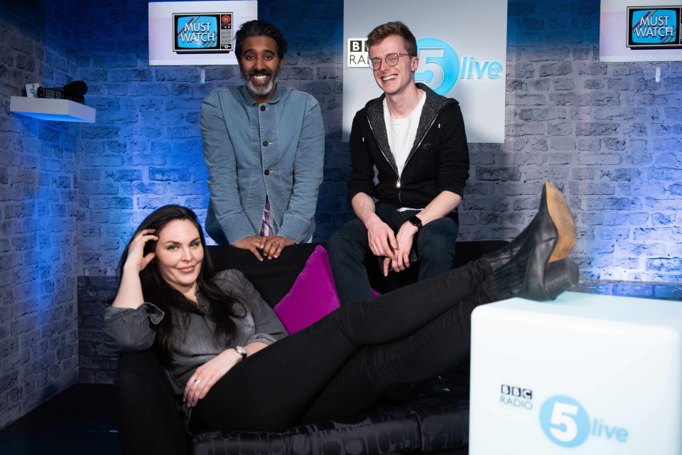 three people sit on a couch in front of a bbc radio 5 live sign