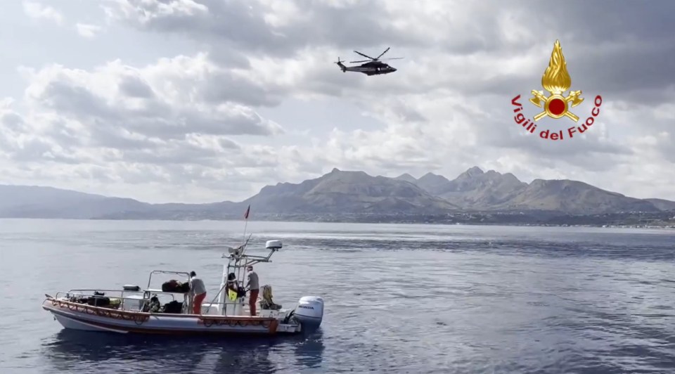 a helicopter is flying over a body of water with a logo for vigili del fuoco