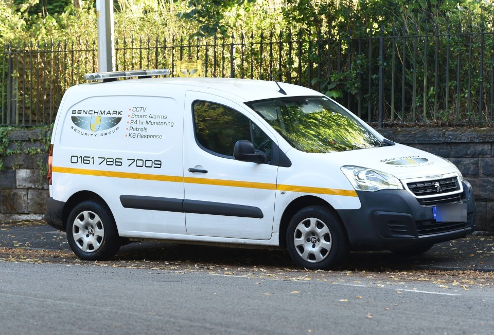 a white van with the word benchmark on the side