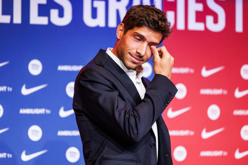 a man wipes his eyes in front of a sign that says lies gracies