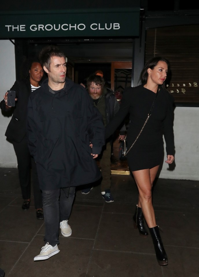 Liam Gallagher leaving the club with partner Debbie Gwyther in 2019