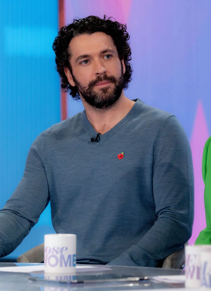 a man in a suit is holding an insidesoap award