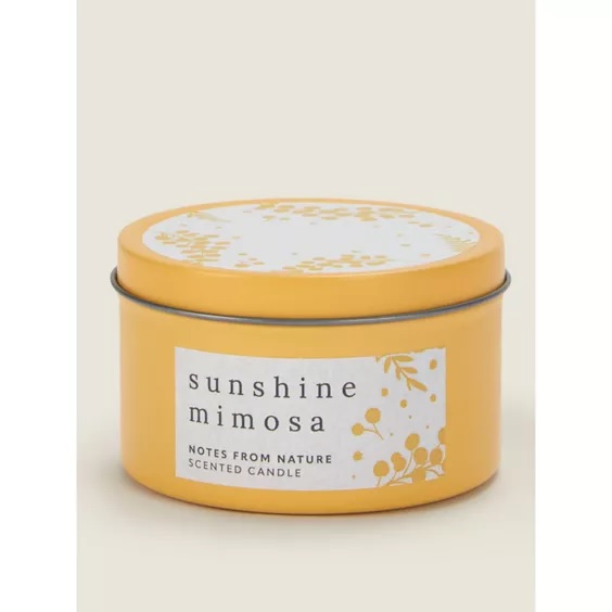 a yellow tin of sunshine mimosa notes from nature scented candle