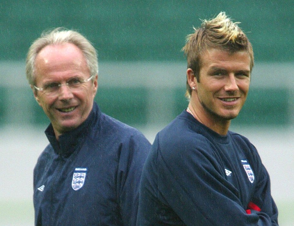 a man and a boy wearing england sweatshirts