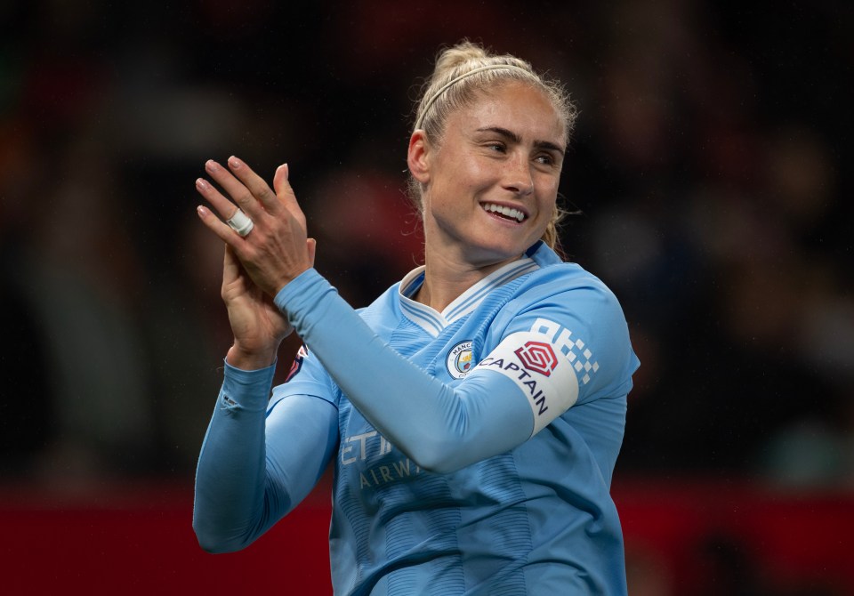 a female soccer player with a captain armband on her arm