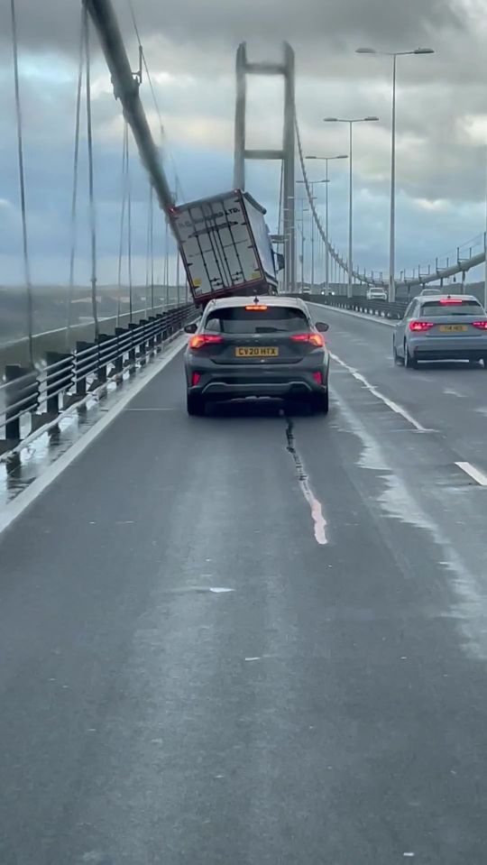 a car with a license plate that says lkf tdkfz drives down a highway