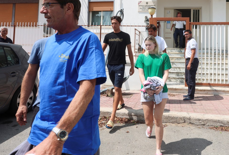 A survivor rescued from the water leaves the Coast Guard Headquarters