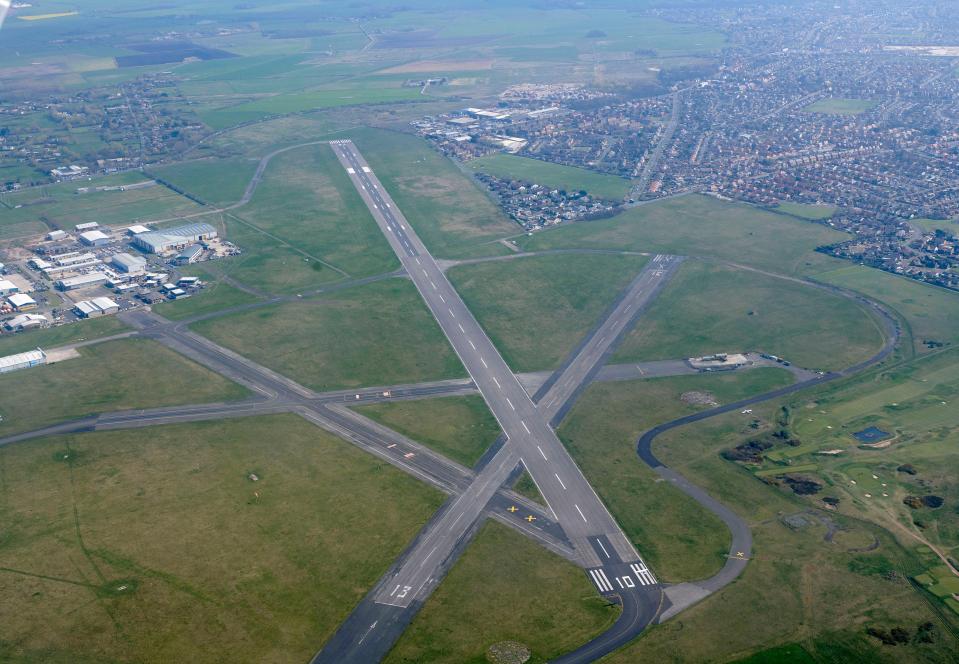 an aerial view of a runway with the number 13 on it