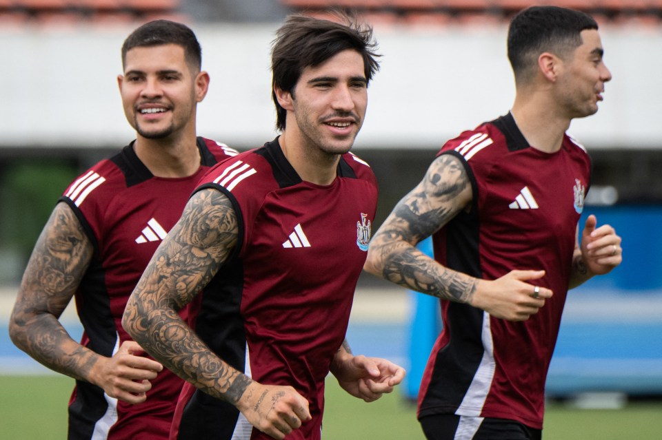 three soccer players wearing adidas jerseys are running on a field