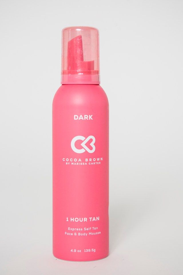 a pink bottle of 1 hour tan by cocoa brown