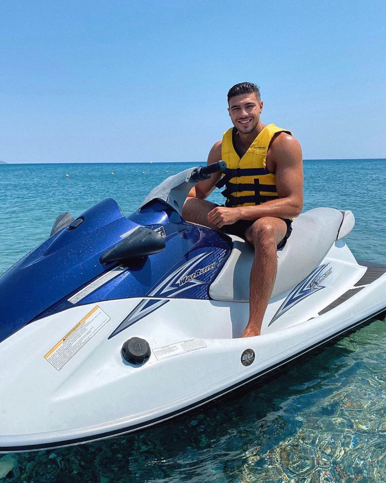 a man is sitting on a yamaha jet ski