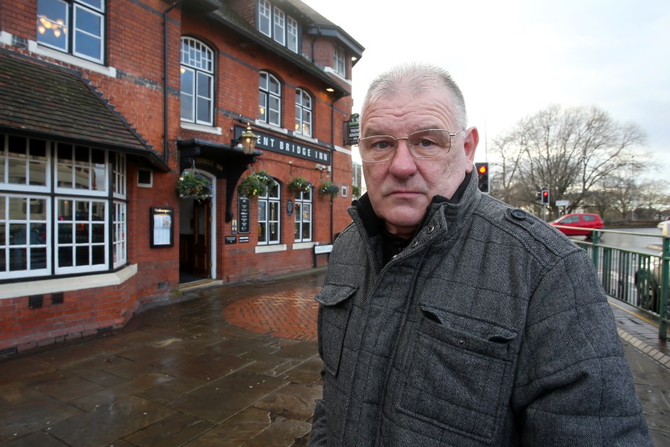 a man stands in front of the ent bridge inn