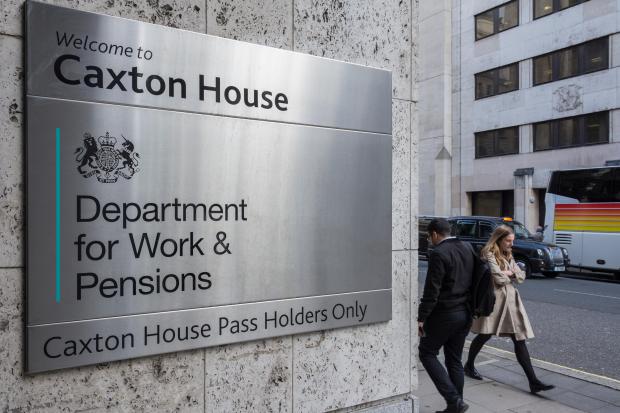 a sign for the caxton house department for work and pensions