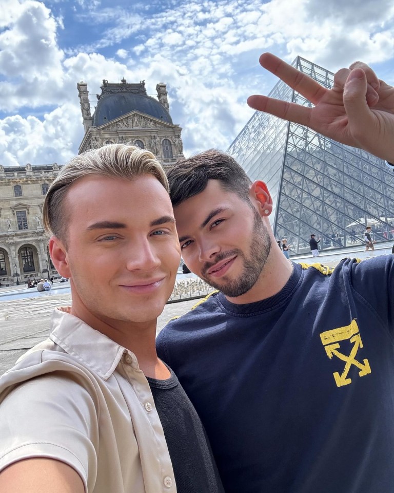 two men posing for a picture with one wearing a shirt that says " off white "