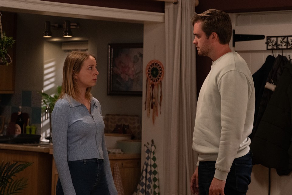 She looks visibly terrified as he lets himself into her house