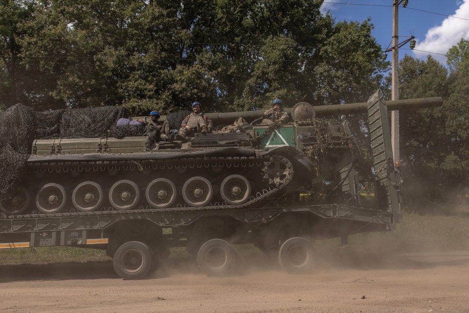 The white triangle symbol on a Ukrainian armoured vehicle heading into Russia