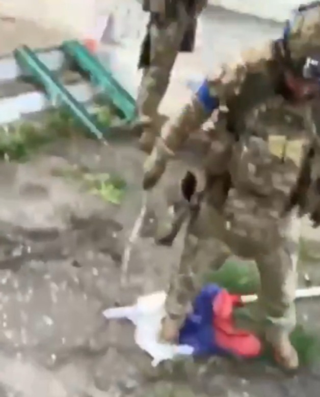 One of the troops can be seen stamping on the downed Russian flag