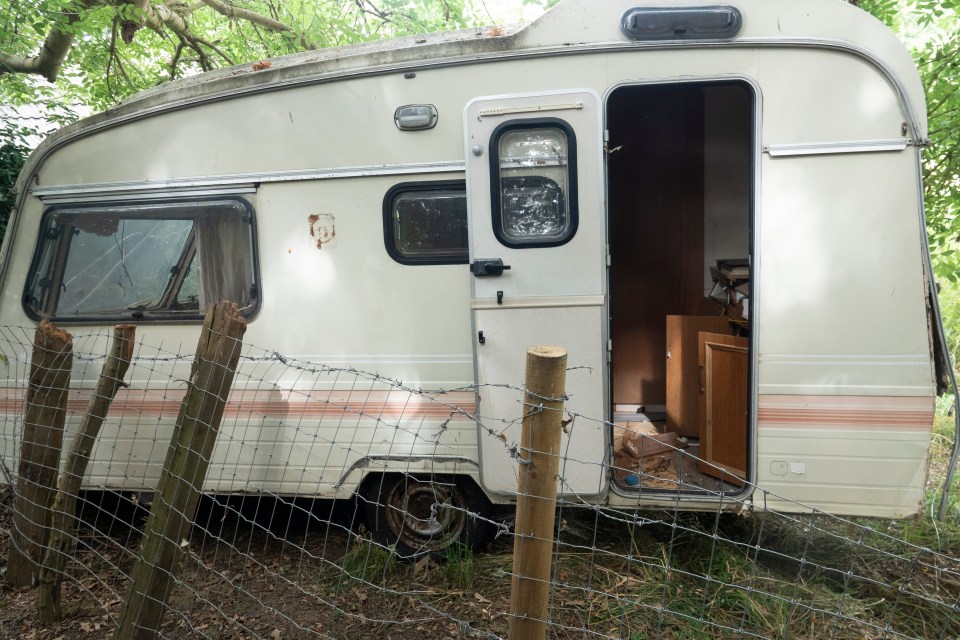 Rows of beaten-up, rotting caravans have been put along the public access path