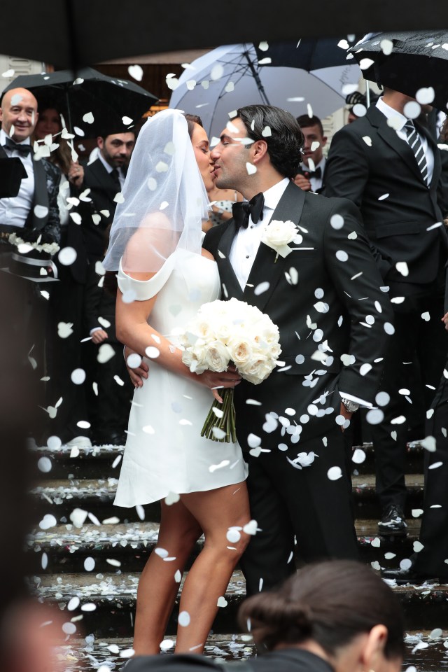 They shared a kiss after the ceremony as their pals showered them with confetti