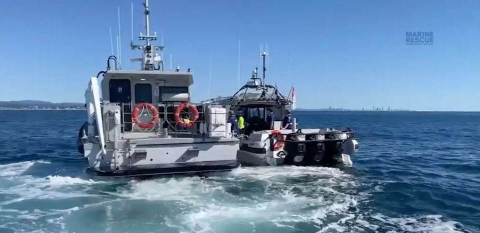 two boats in the ocean with the words marine rescue on the bottom