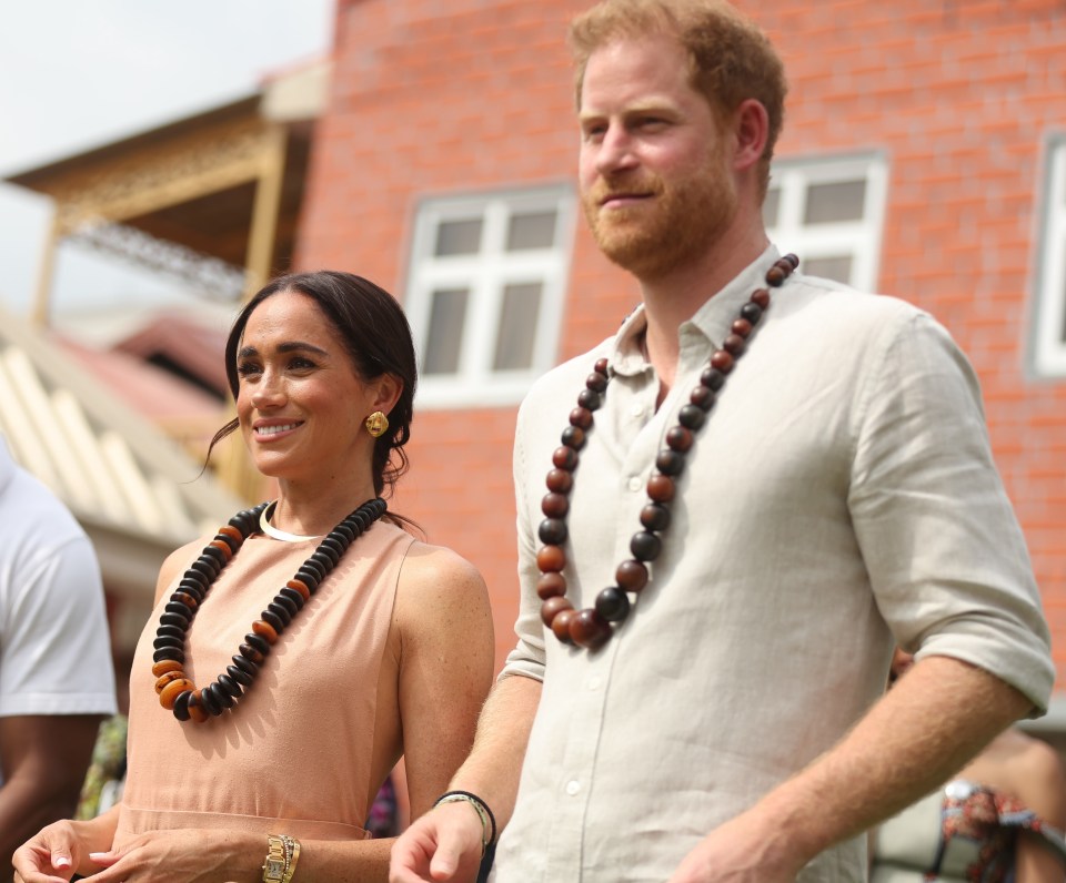 Duke of Sussex Prince Harry his wife Meghan Markle, Duchess of Sussex, visit the Lightway Academy in Abuja, Nigeria