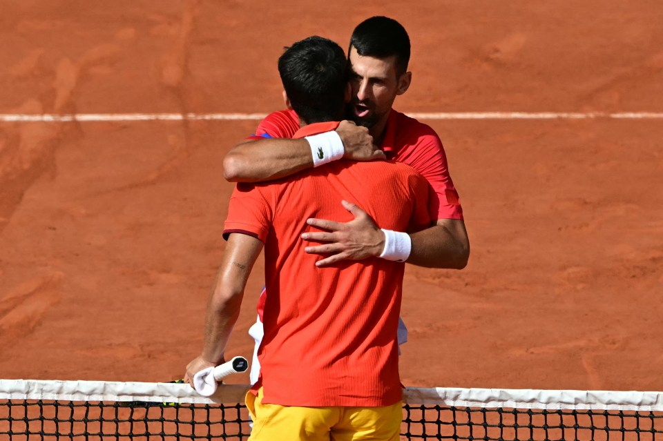 The tennis icon hugs opponent Carlos Alcaraz