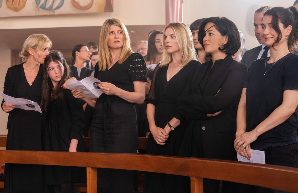 a group of women in black standing in a church