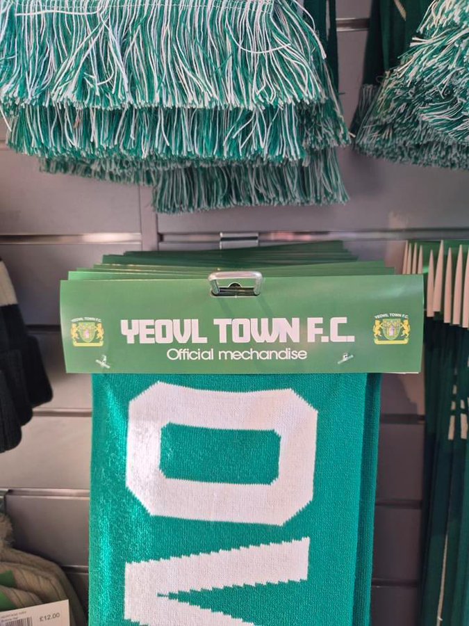 a green scarf that says yeovil town f.c. on it