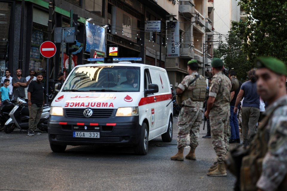 a white ambulance with a license plate that says xga 332