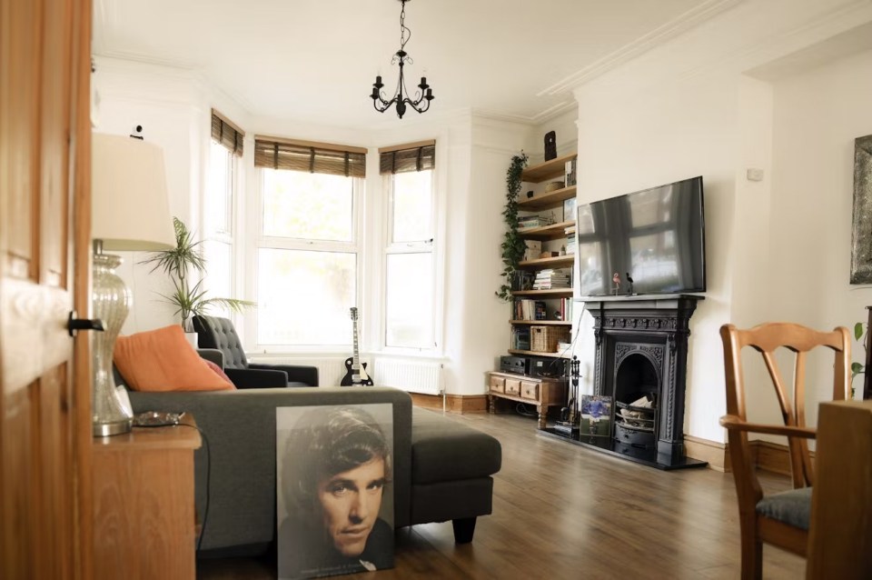 This home is decked out with a living room to mirror Oasis' iconic 1994 album cover