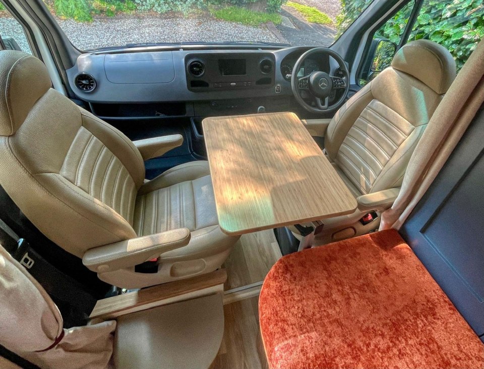 The seats at the front of the van can turn to make a dining table for two