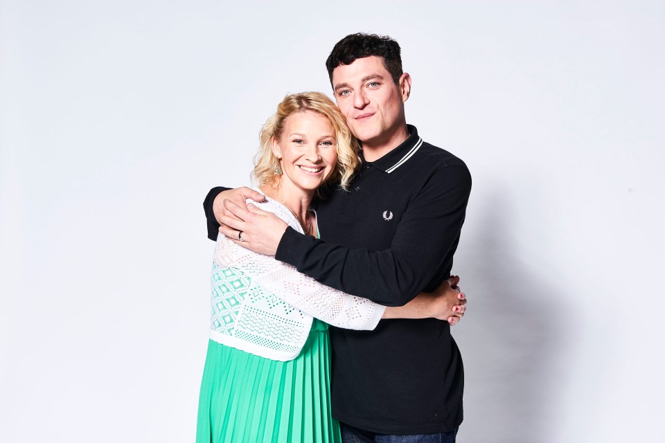 a man in a fred perry shirt is hugging a woman in a green dress