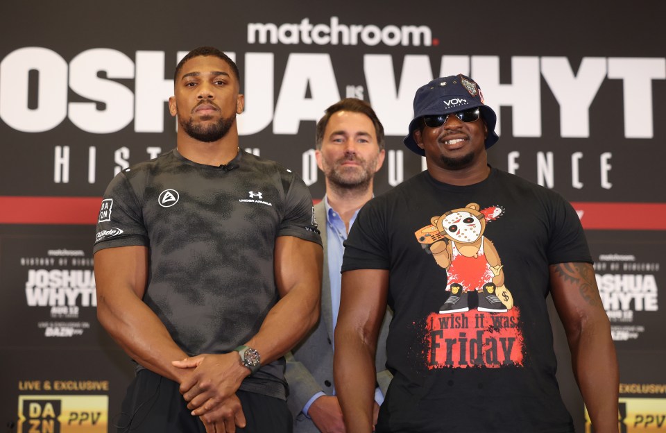 two men standing in front of a sign that says matchroom