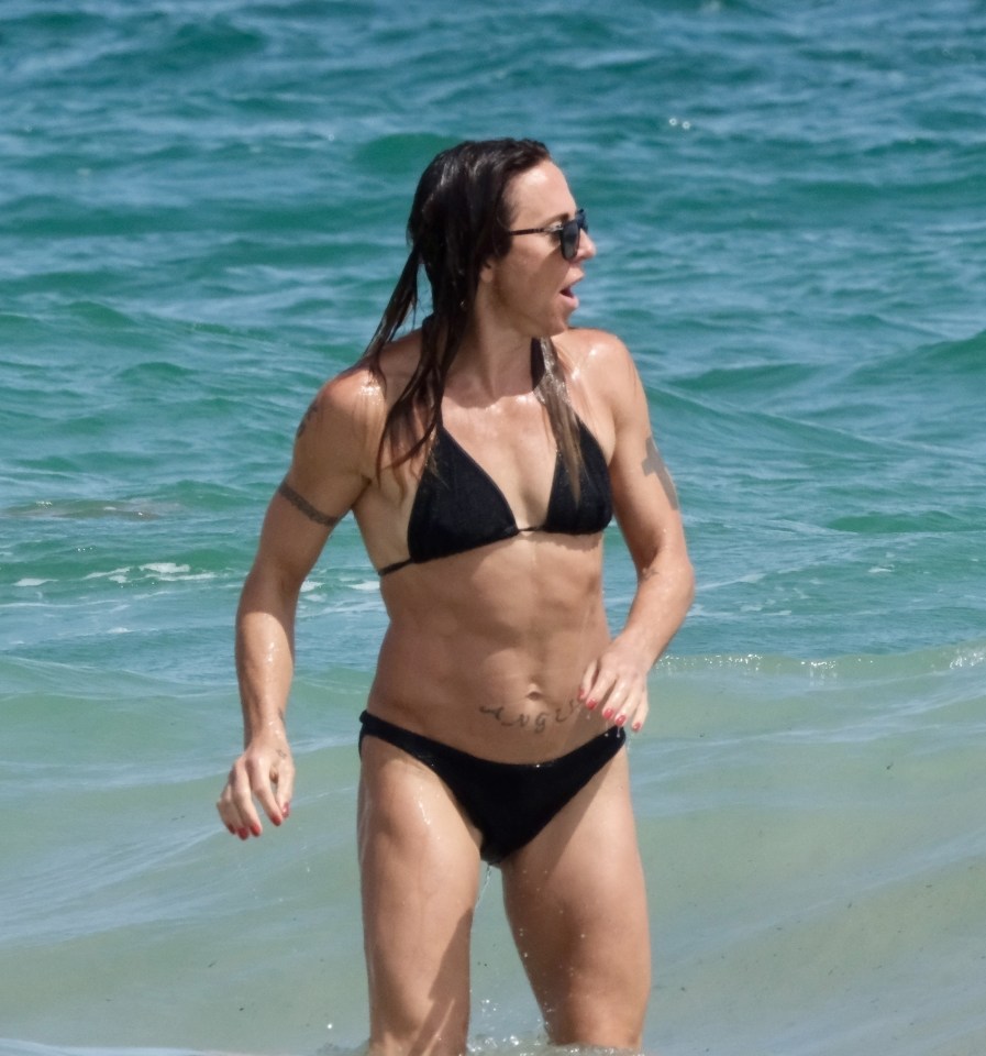 Mel showed off her taut abs in a black bikini