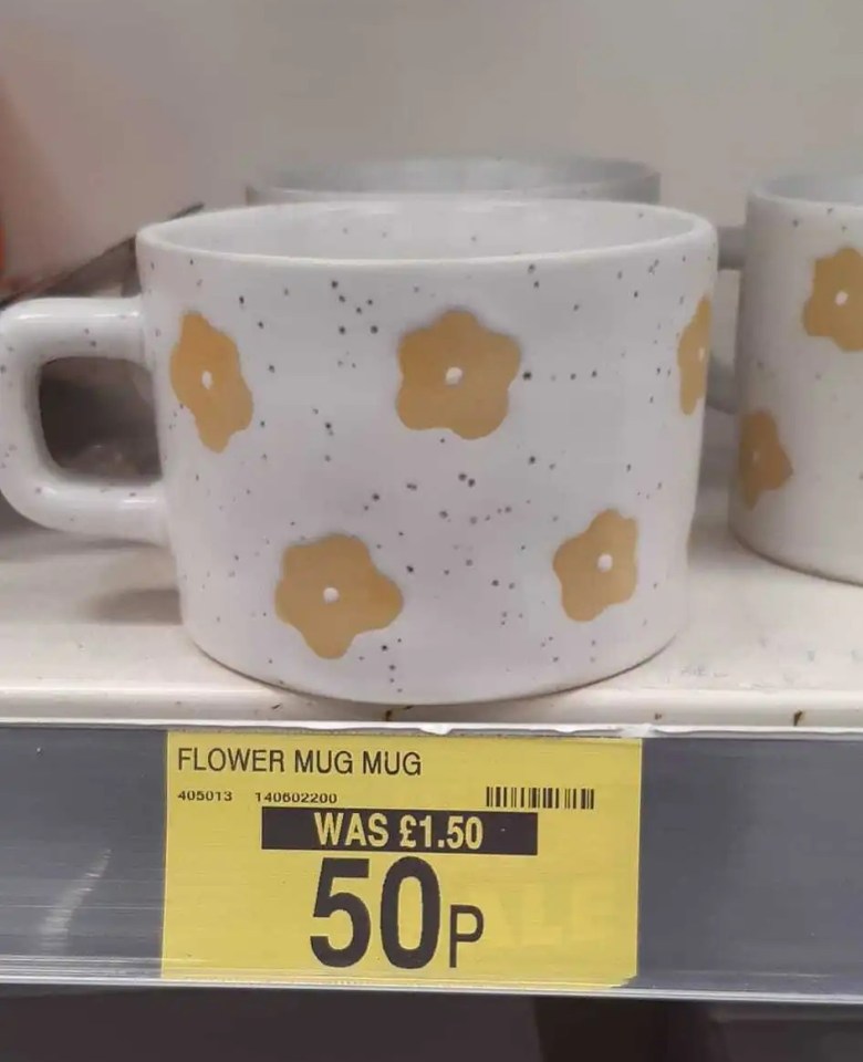 a white mug with yellow flowers on it is for sale for 50p